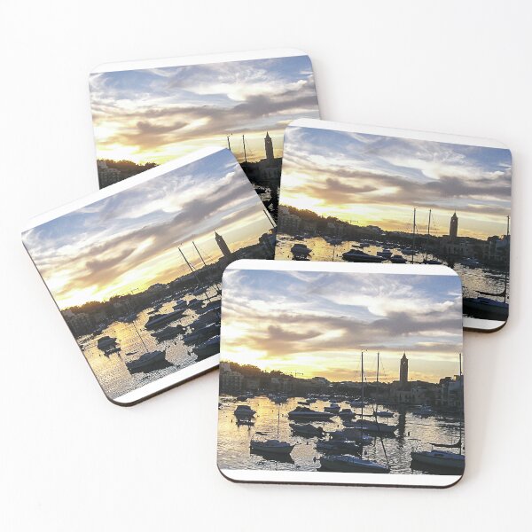 Item preview, Sunset Harbor With Moored Boats and Coastal Town Skyline Reflected on Calm Water designed and sold by Nmallia.