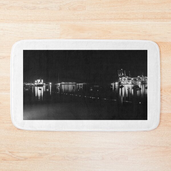 Item preview, Nighttime Container Port With Illuminated Gantry Cranes and Reflections on Calm Harbor Waters designed and sold by Nmallia.