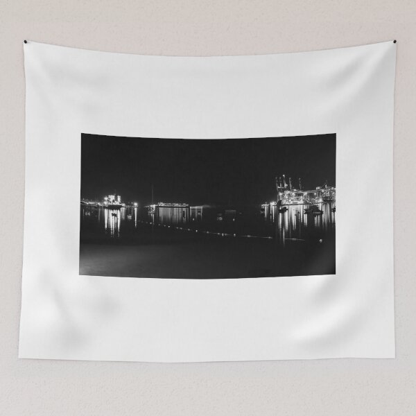 Item preview, Nighttime Container Port With Illuminated Gantry Cranes and Reflections on Calm Harbor Waters designed and sold by Nmallia.