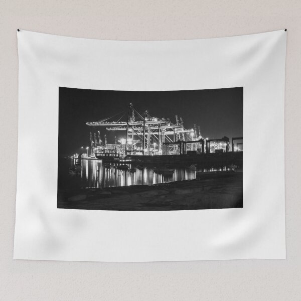 Item preview, Nighttime Container Port With Illuminated Gantry Cranes and Reflections on Calm Harbor Waters designed and sold by Nmallia.