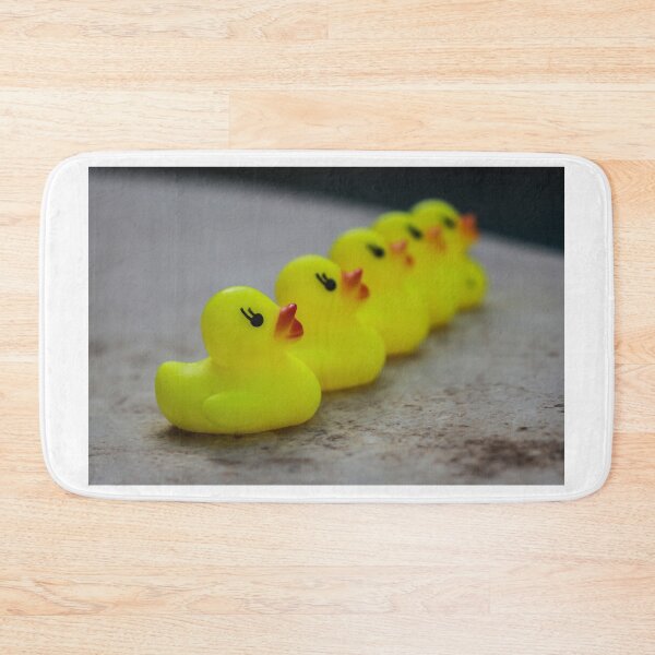 Item preview, Row Of Yellow Rubber Duck Toys Lined Up Evoking Playful Bath Time And Childhood Memories designed and sold by Nmallia.