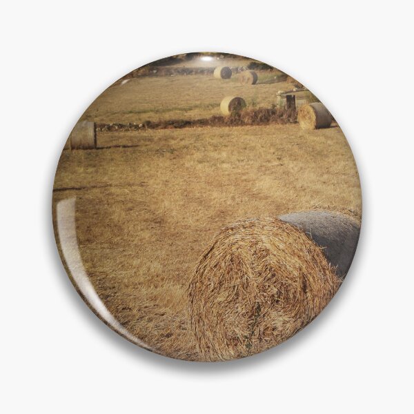 Item preview, Golden Hay Bales in Harvested Field Near Rural Farmhouses at Sunset Countryside Landscape designed and sold by Nmallia.