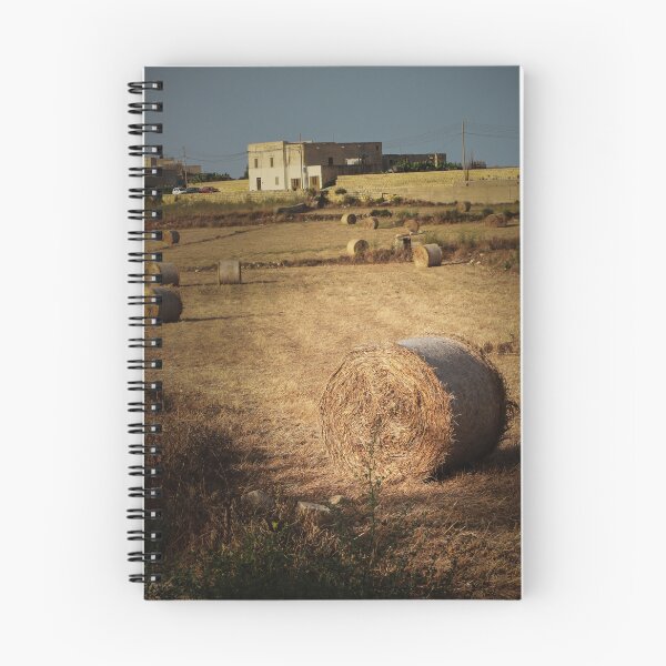 Item preview, Golden Hay Bales in Harvested Field Near Rural Farmhouses at Sunset Countryside Landscape designed and sold by Nmallia.
