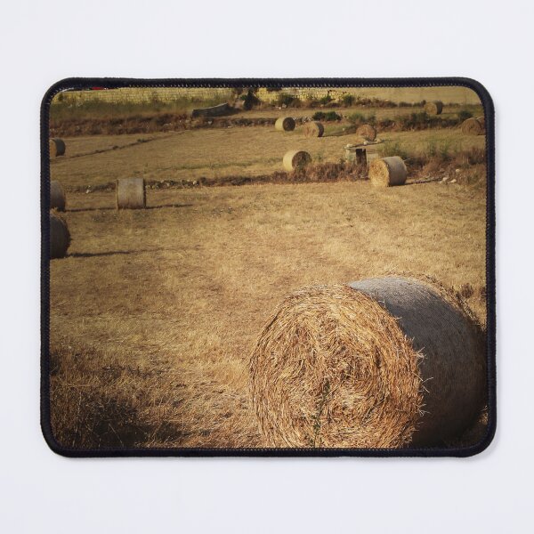 Item preview, Golden Hay Bales in Harvested Field Near Rural Farmhouses at Sunset Countryside Landscape designed and sold by Nmallia.