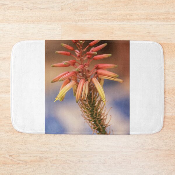 Item preview, Aloe Flower Close-Up With Orange and Yellow Tubular Blooms On Succulent Stem In Soft Bokeh designed and sold by Nmallia.