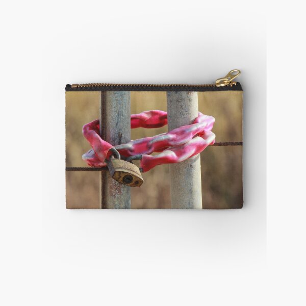 Item preview, Rusty Padlock Securing Pink Plastic-Wrapped Chain Around Metal Gate Posts With Shallow Focus designed and sold by Nmallia.
