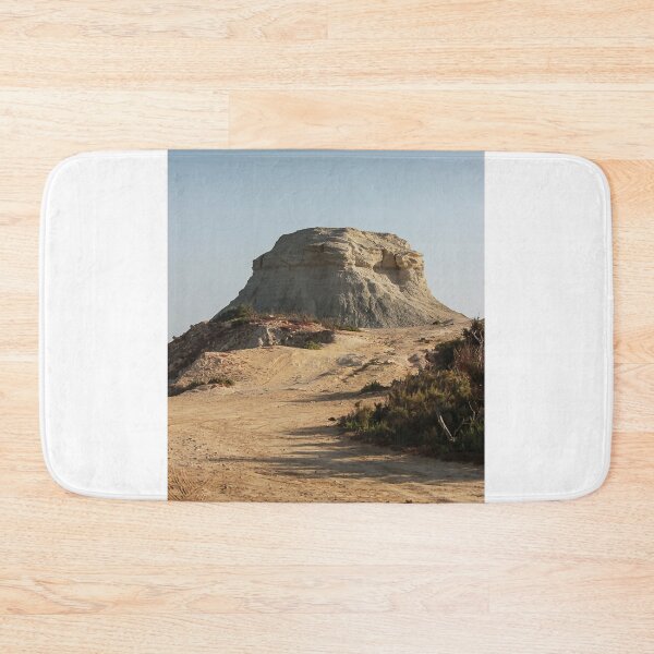 Item preview, Desert Butte Landscape With Eroded Rock Formation Under Clear Blue Sky And Sandy Track designed and sold by Nmallia.