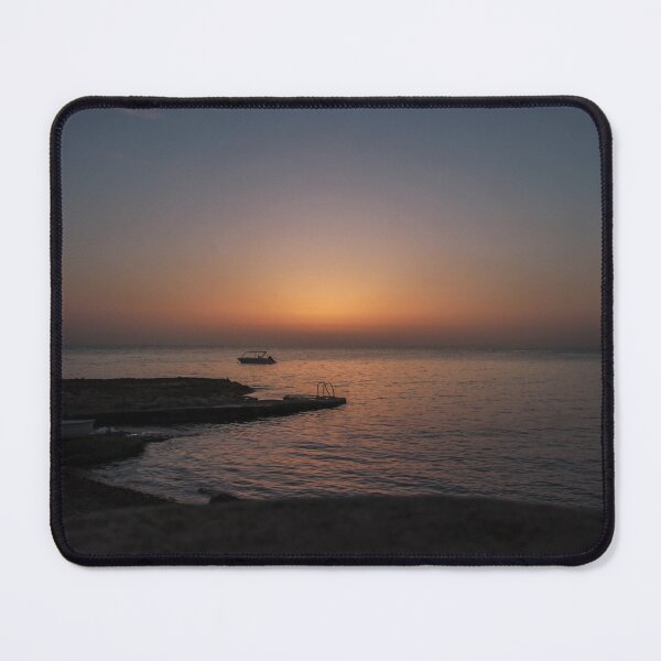 Item preview, Quiet Sunset Over Calm Sea With Small Boat Near Rocky Pier and Ladder at Dusk designed and sold by Nmallia.