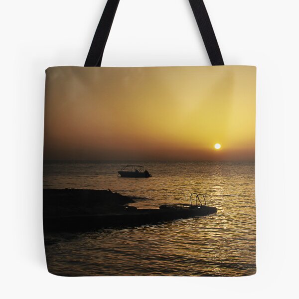 Item preview, Quiet Sunset Over Calm Sea With Small Boat Near Rocky Pier and Ladder at Dusk designed and sold by Nmallia.