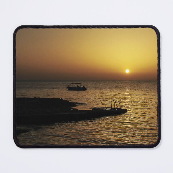 Item preview, Quiet Sunset Over Calm Sea With Small Boat Near Rocky Pier and Ladder at Dusk designed and sold by Nmallia.