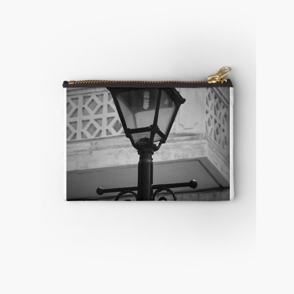 Item preview, Vintage Street Lamp In Black And White With Ornate Ironwork Against Old Building Facade designed and sold by Nmallia.