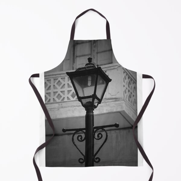 Item preview, Vintage Street Lamp In Black And White With Ornate Ironwork Against Old Building Facade designed and sold by Nmallia.