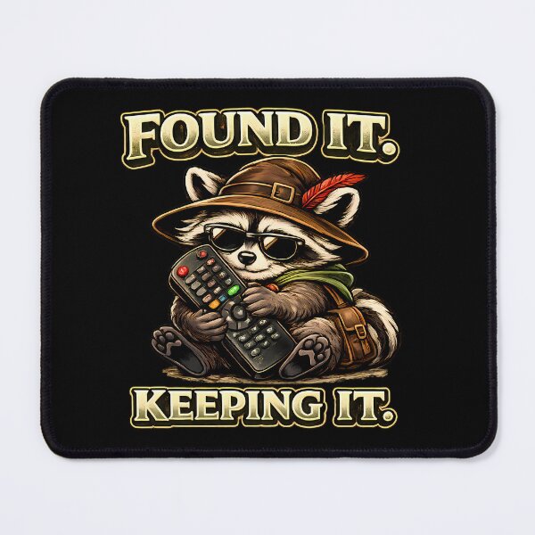 Item preview, Found It Keeping It Funny Raccoon Remote Control Gamer Vintage Graphic T-Shirt designed and sold by clockedoutwearshop.