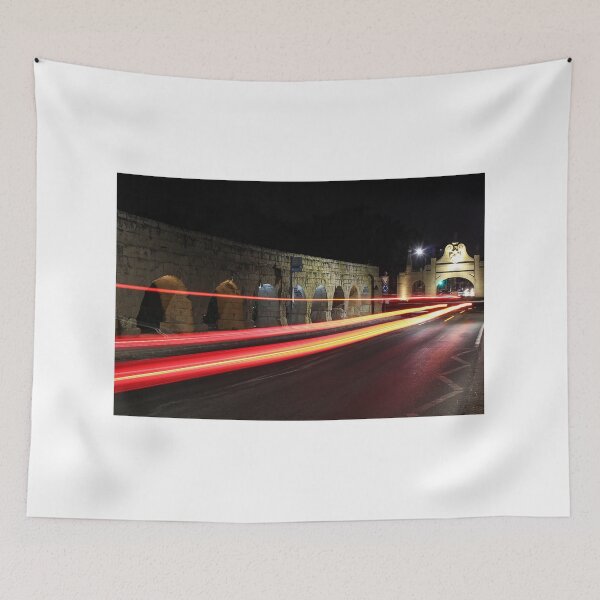 Item preview, Night Light Trails Along Historic Stone Arches and Archway Bridge With Fast Moving Traffic designed and sold by Nmallia.