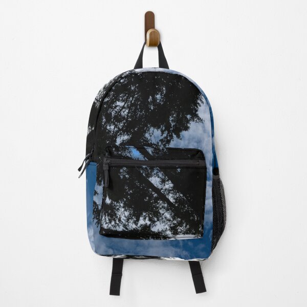 Item preview, Ultrawide shot upward of converging trees against cloudy blue sky designed and sold by lisavonbiela.