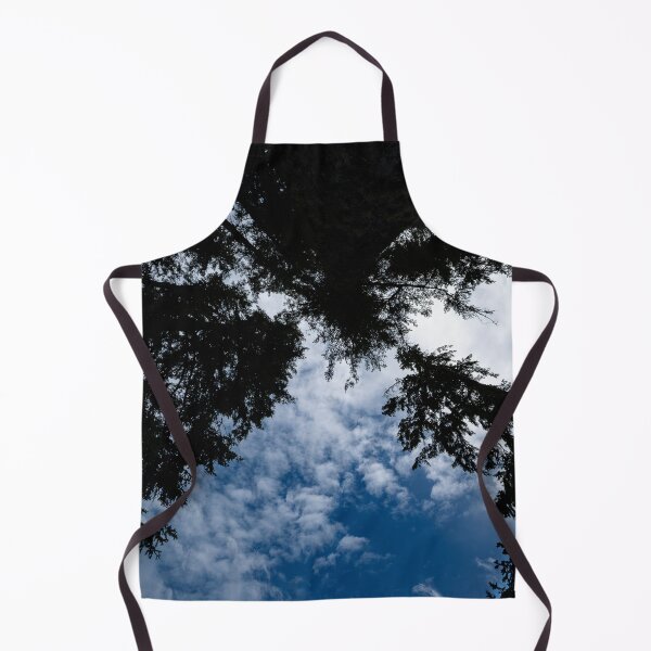 Item preview, Ultrawide shot upward of converging trees against cloudy blue sky designed and sold by lisavonbiela.