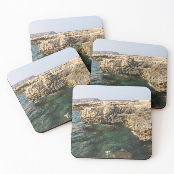 Item preview, Rocky Coastal Cliffs Over Clear Turquoise Sea With Submerged Rocks and Sunny Sky designed and sold by Nmallia.
