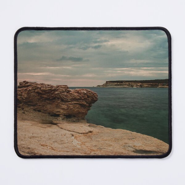 Item preview, Moody Rocky Shoreline and Coastal Harbor Waterfront Along Calm Sea Under Overcast Sky designed and sold by Nmallia.