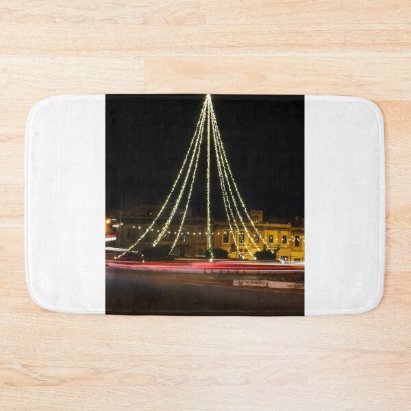 Item preview, Christmas Lights Tree on Roundabout With Long Exposure Traffic Light Trails at Night designed and sold by Nmallia.