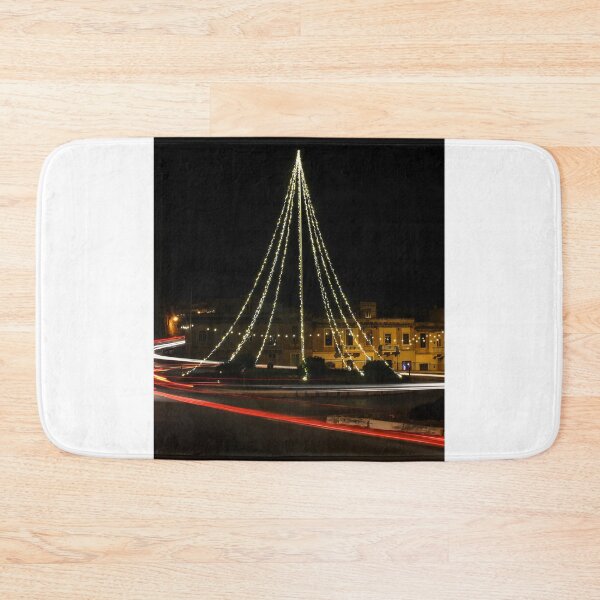 Item preview, Christmas Lights Tree on Roundabout With Long Exposure Traffic Light Trails at Night designed and sold by Nmallia.