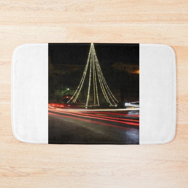 Item preview, Christmas Lights Tree on Roundabout With Long Exposure Traffic Light Trails at Night designed and sold by Nmallia.
