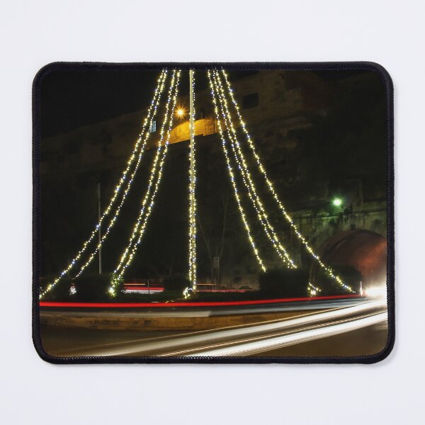 Item preview, Christmas Lights Tree on Roundabout With Long Exposure Traffic Light Trails at Night designed and sold by Nmallia.