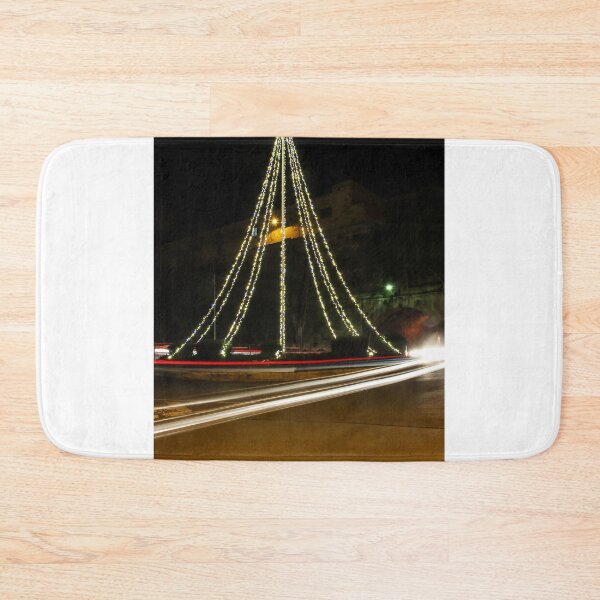 Item preview, Christmas Lights Tree on Roundabout With Long Exposure Traffic Light Trails at Night designed and sold by Nmallia.