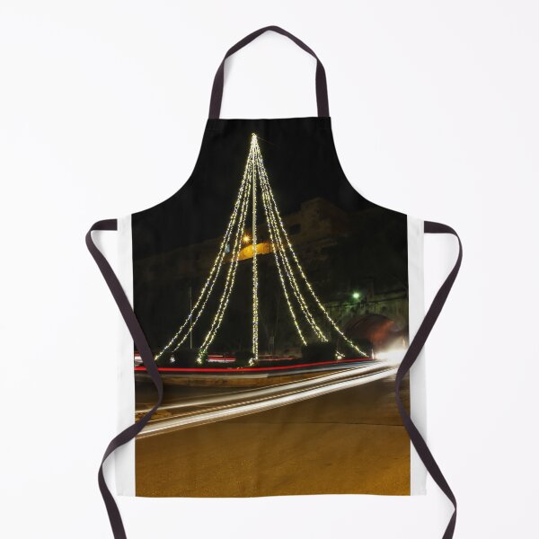 Item preview, Christmas Lights Tree on Roundabout With Long Exposure Traffic Light Trails at Night designed and sold by Nmallia.