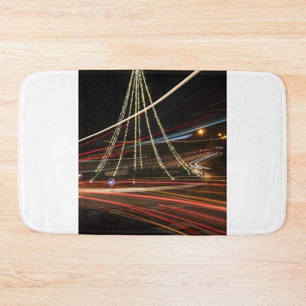 Item preview, Christmas Lights Tree on Roundabout With Long Exposure Traffic Light Trails at Night designed and sold by Nmallia.