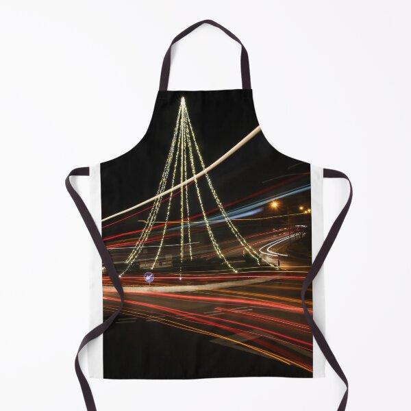Item preview, Christmas Lights Tree on Roundabout With Long Exposure Traffic Light Trails at Night designed and sold by Nmallia.