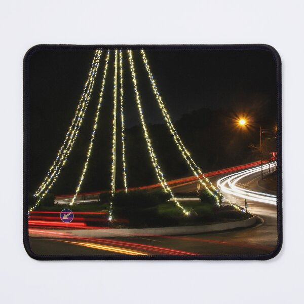 Item preview, Christmas Lights Tree on Roundabout With Long Exposure Traffic Light Trails at Night designed and sold by Nmallia.