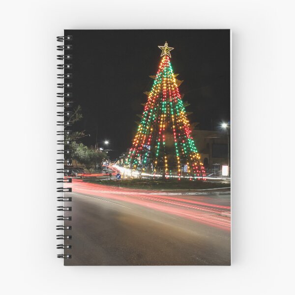 Item preview, Festive Christmas Tree With Colorful Lights and Star Topper Illuminating Nighttime Street designed and sold by Nmallia.