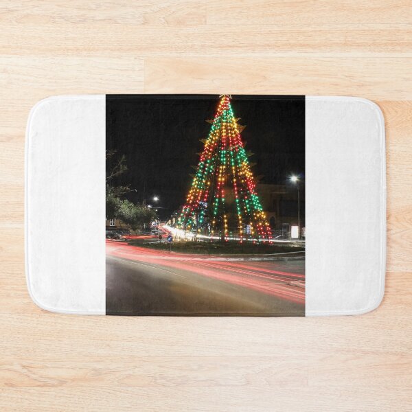 Item preview, Festive Christmas Tree With Colorful Lights and Star Topper Illuminating Nighttime Street designed and sold by Nmallia.