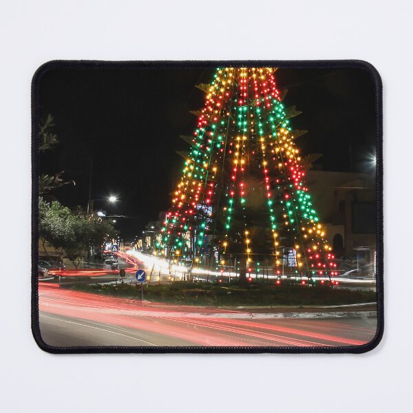 Item preview, Festive Christmas Tree With Colorful Lights and Star Topper Illuminating Nighttime Street designed and sold by Nmallia.