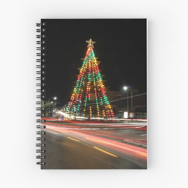 Item preview, Festive Christmas Tree With Colorful Lights and Star Topper Illuminating Nighttime Street designed and sold by Nmallia.