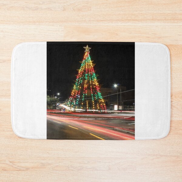 Item preview, Festive Christmas Tree With Colorful Lights and Star Topper Illuminating Nighttime Street designed and sold by Nmallia.