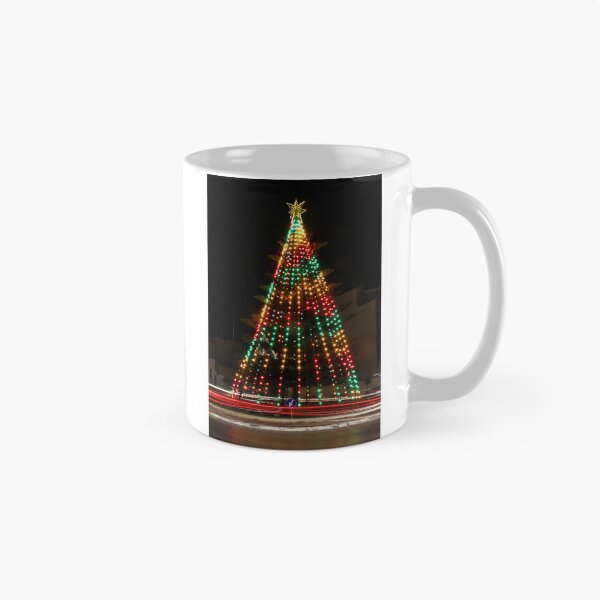 Item preview, Festive Christmas Tree With Colorful Lights and Star Topper Illuminating Nighttime Street designed and sold by Nmallia.