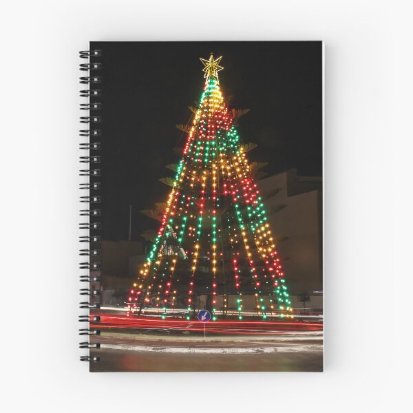Item preview, Festive Christmas Tree With Colorful Lights and Star Topper Illuminating Nighttime Street designed and sold by Nmallia.