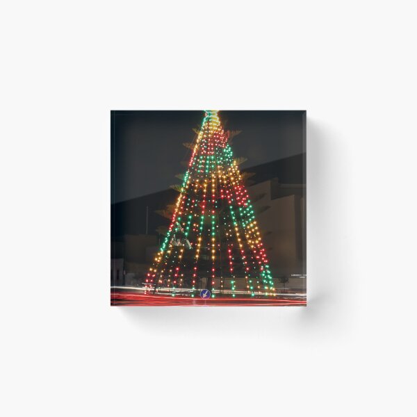 Item preview, Festive Christmas Tree With Colorful Lights and Star Topper Illuminating Nighttime Street designed and sold by Nmallia.