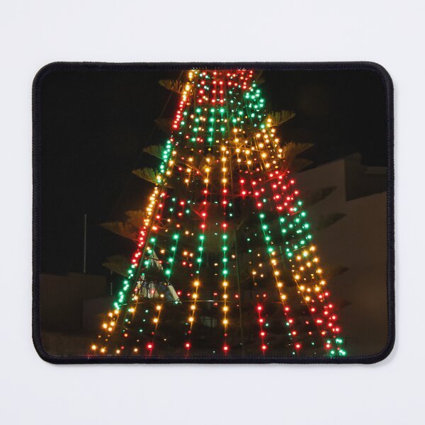 Item preview, Festive Christmas Tree With Colorful Lights and Star Topper Illuminating Nighttime Street designed and sold by Nmallia.
