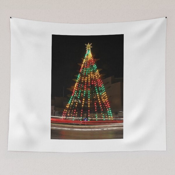 Item preview, Festive Christmas Tree With Colorful Lights and Star Topper Illuminating Nighttime Street designed and sold by Nmallia.
