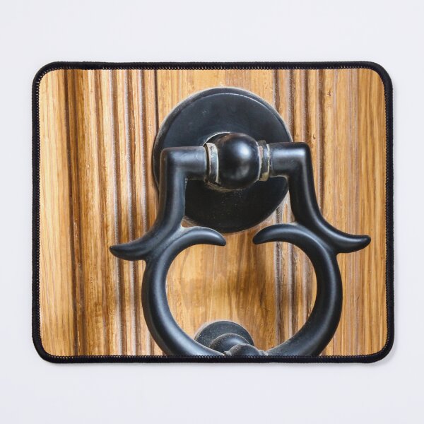 Item preview, Vintage Black Metal Door Knocker On Carved Wooden Front Door Panel Close-Up Entrance designed and sold by Nmallia.