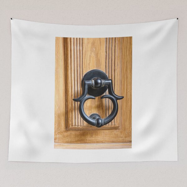 Item preview, Vintage Black Metal Door Knocker On Carved Wooden Front Door Panel Close-Up Entrance designed and sold by Nmallia.