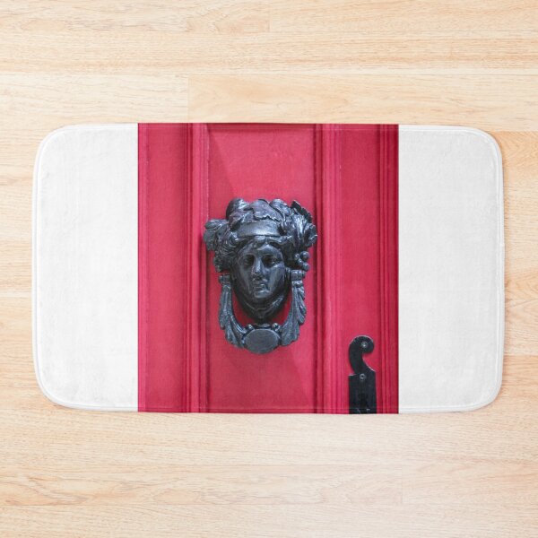 Item preview, Antique Metal Door Knocker On Red Wooden Door Panel With Decorative Face Ornamentation designed and sold by Nmallia.