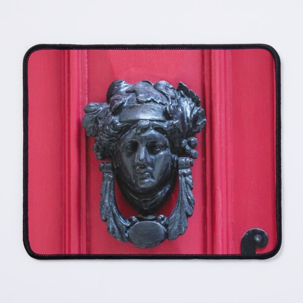 Item preview, Antique Metal Door Knocker On Red Wooden Door Panel With Decorative Face Ornamentation designed and sold by Nmallia.