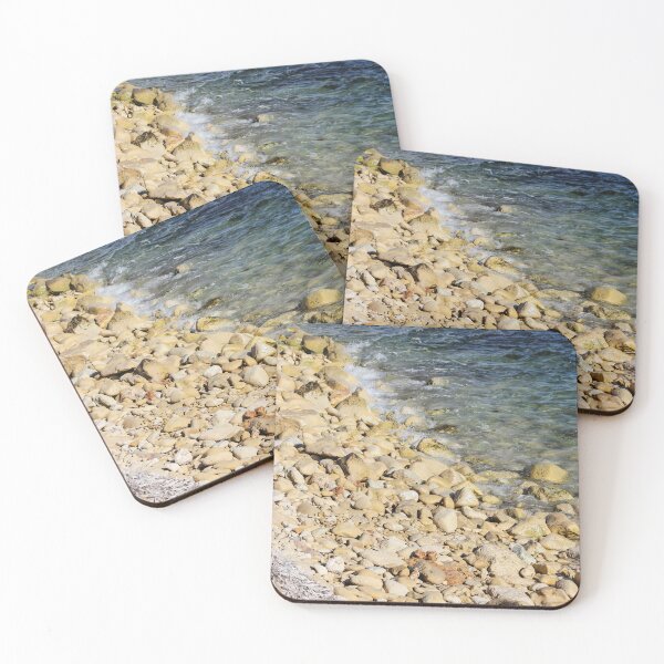Item preview, Rocky Pebble Beach Shore With Clear Blue Sea Waves Lapping Over Stones On Sunny Coastline designed and sold by Nmallia.