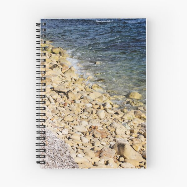 Item preview, Rocky Pebble Beach Shore With Clear Blue Sea Waves Lapping Over Stones On Sunny Coastline designed and sold by Nmallia.