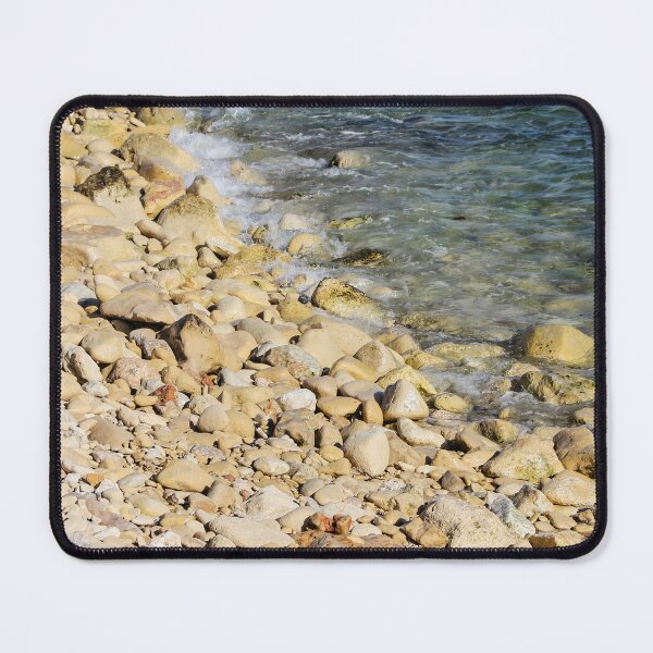 Item preview, Rocky Pebble Beach Shore With Clear Blue Sea Waves Lapping Over Stones On Sunny Coastline designed and sold by Nmallia.