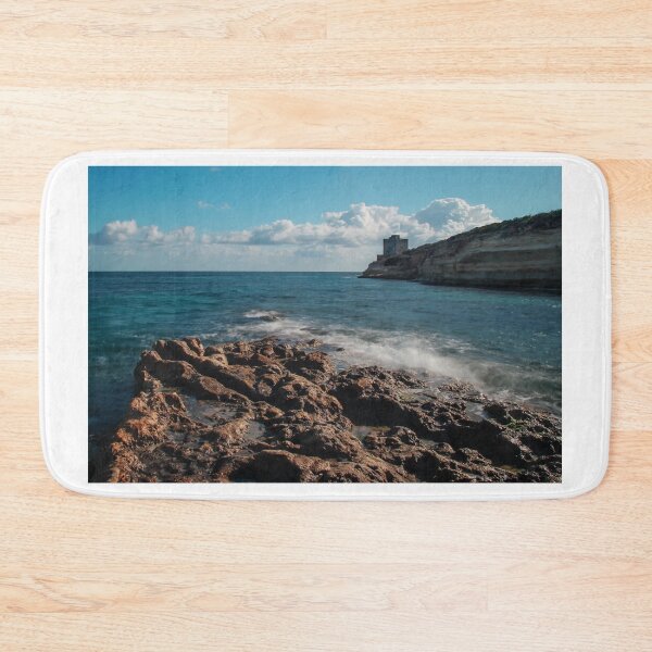 Item preview, Seaside Rocky Coastline With Historic Tower on Cliff Under Blue Sky and Clouds designed and sold by Nmallia.