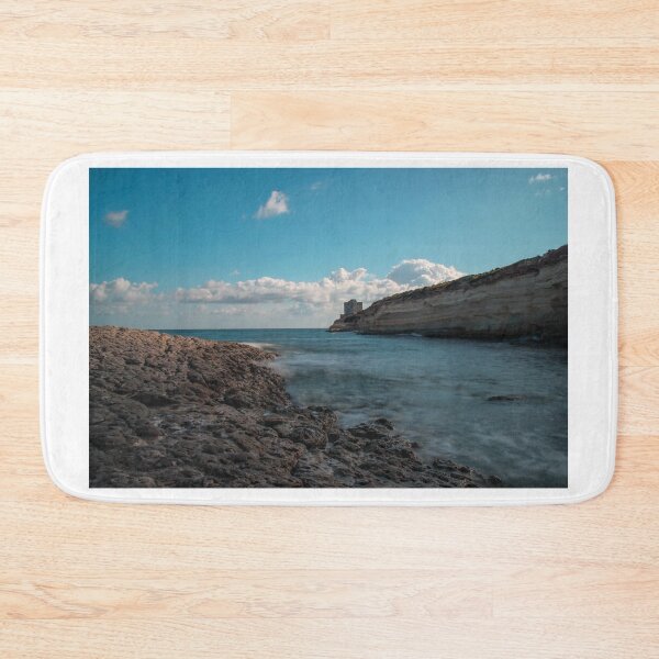 Item preview, Seaside Rocky Coastline With Historic Tower on Cliff Under Blue Sky and Clouds designed and sold by Nmallia.